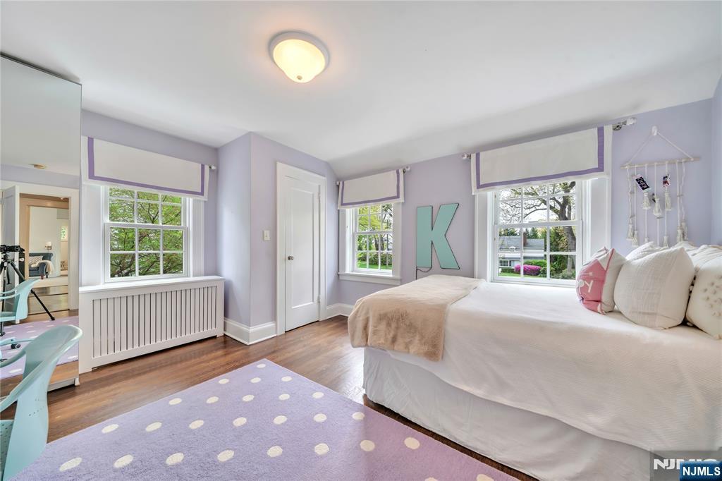 227 Fairmount Road Ridgewood, NJ 07450 - Photo 38 of 50 a bedroom with a bed and a large window