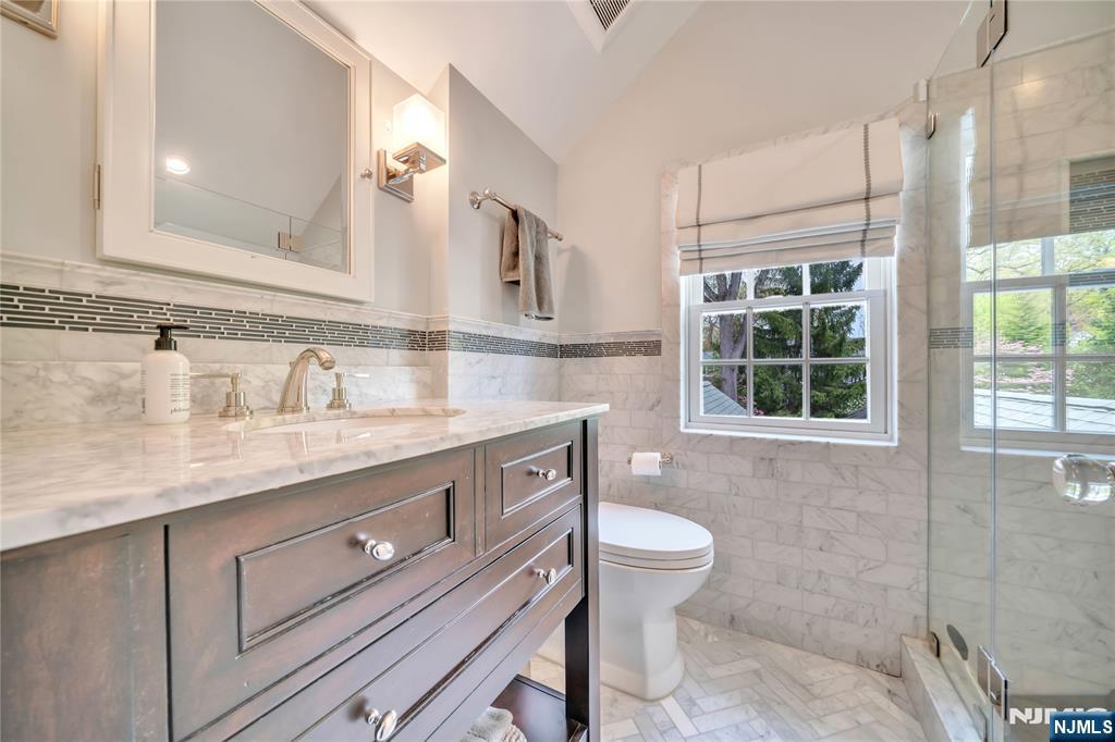 227 Fairmount Road Ridgewood, NJ 07450 - Photo 42 of 50 a bathroom with a granite countertop sink toilet and shower
