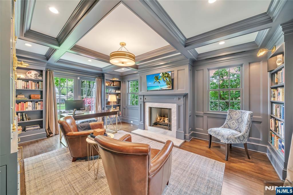 227 Fairmount Road Ridgewood, NJ 07450 - Photo 10 of 50 a living room with furniture a fireplace and a large window