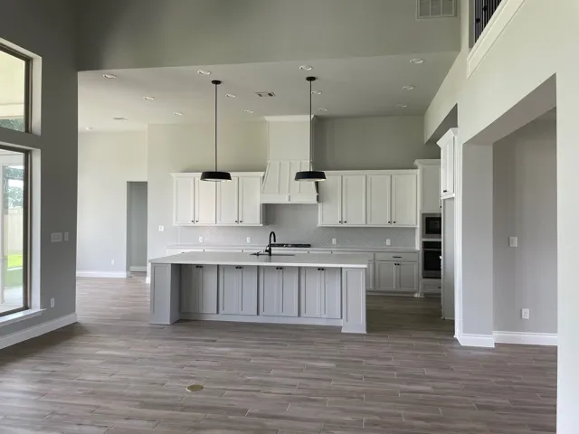 a bathroom with a bathtub sink and mirror