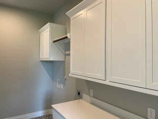 a bathroom with a window and a shower