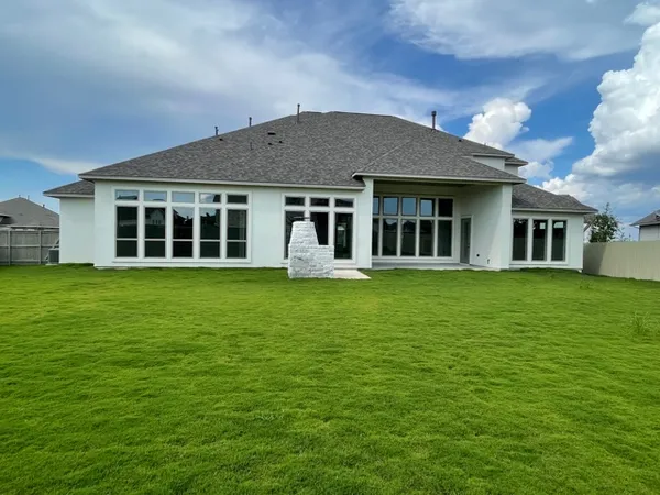 a house view with a garden space