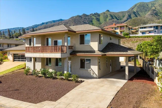 front view of a house with a yard