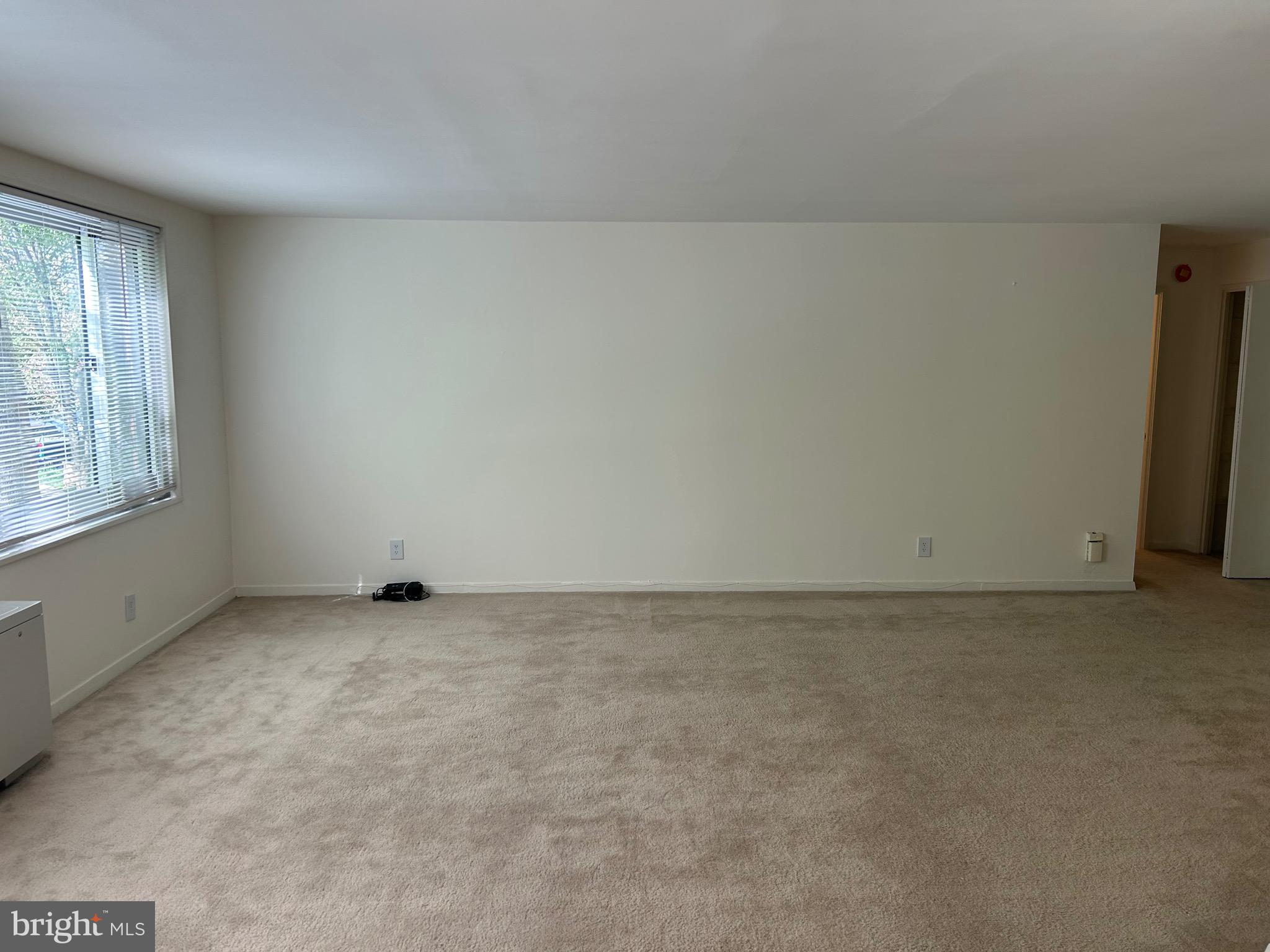 1900 Lyttonsville Road, Unit 214 Silver Spring, MD 20910 - Photo 13 of 21 an empty room with windows