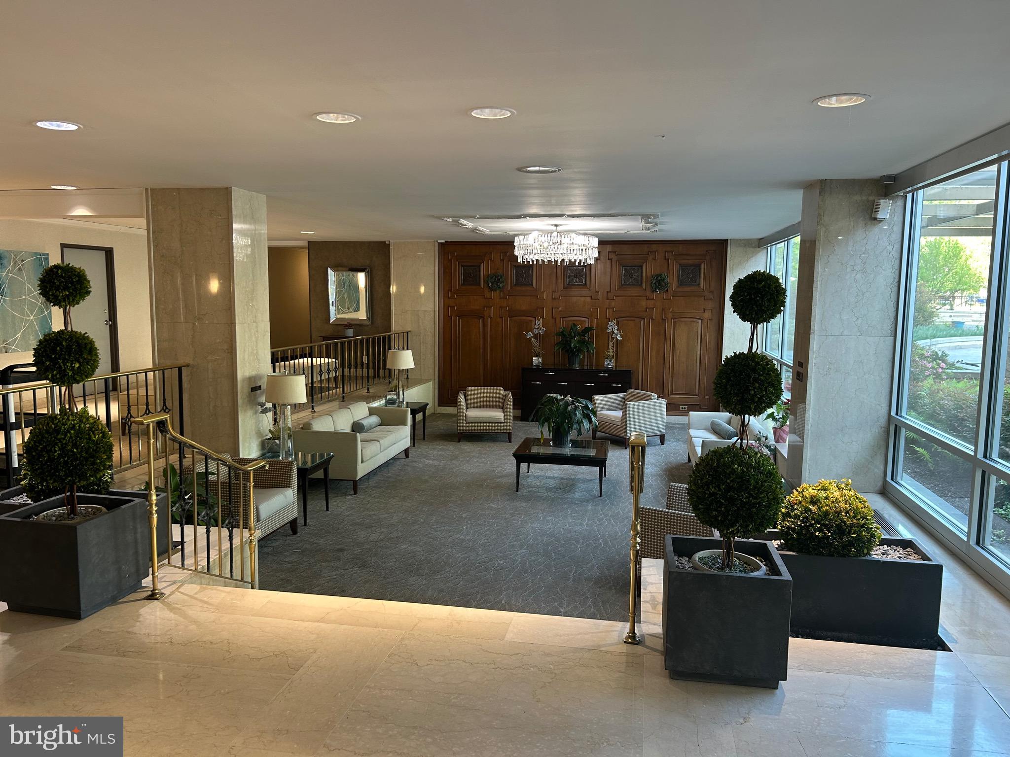1900 Lyttonsville Road, Unit 214 Silver Spring, MD 20910 - Photo 2 of 21 a living room with furniture and a large window