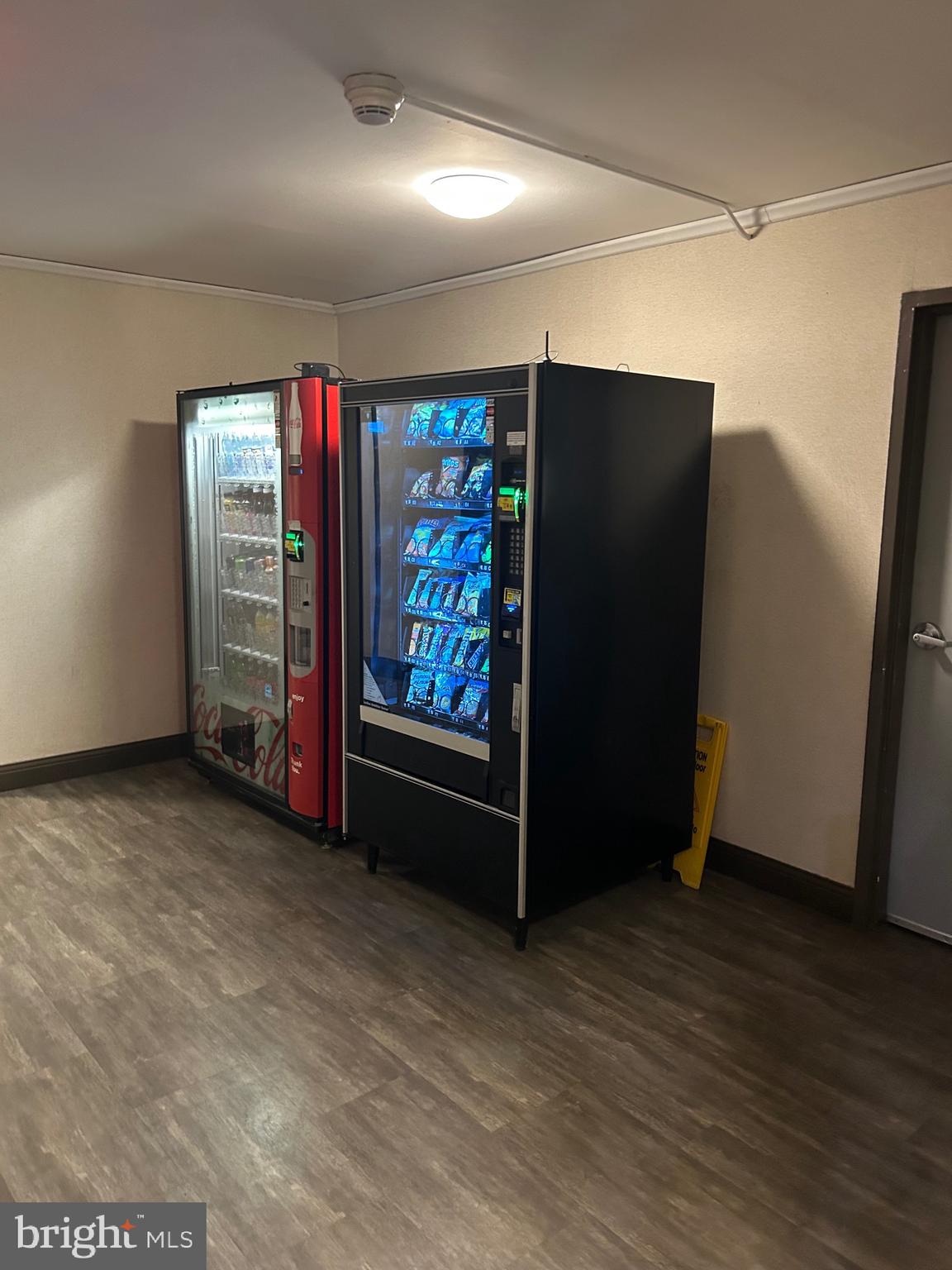1900 Lyttonsville Road, Unit 214 Silver Spring, MD 20910 - Photo 21 of 21 a view of an empty room with wooden floor and closet