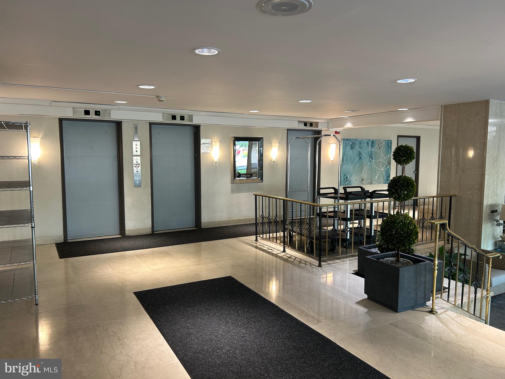 1900 Lyttonsville Road, Unit 214 Silver Spring, MD 20910 - Photo 3 of 21 a view of a lobby with black carpet