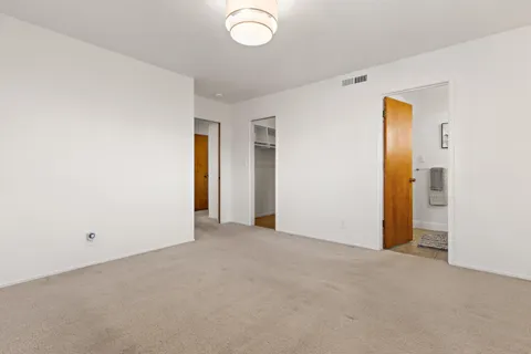 an empty room with a bathroom