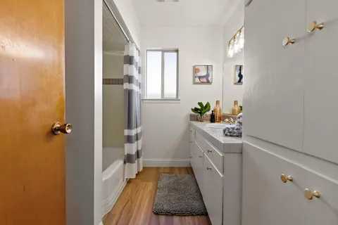 a kitchen with a sink and refrigerator