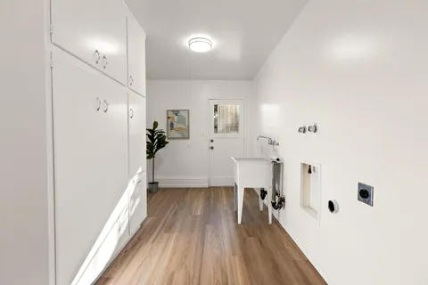 a view of a bedroom with a bed and a window