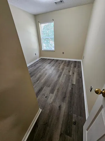 a view of entryway with wooden floor