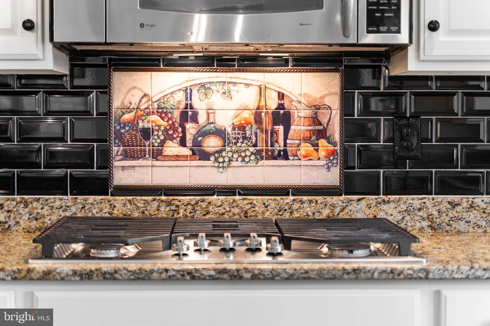 20718 Annondell Drive Lewes, DE 19958 - Photo 11 of 46 a kitchen with a stove and a microwave