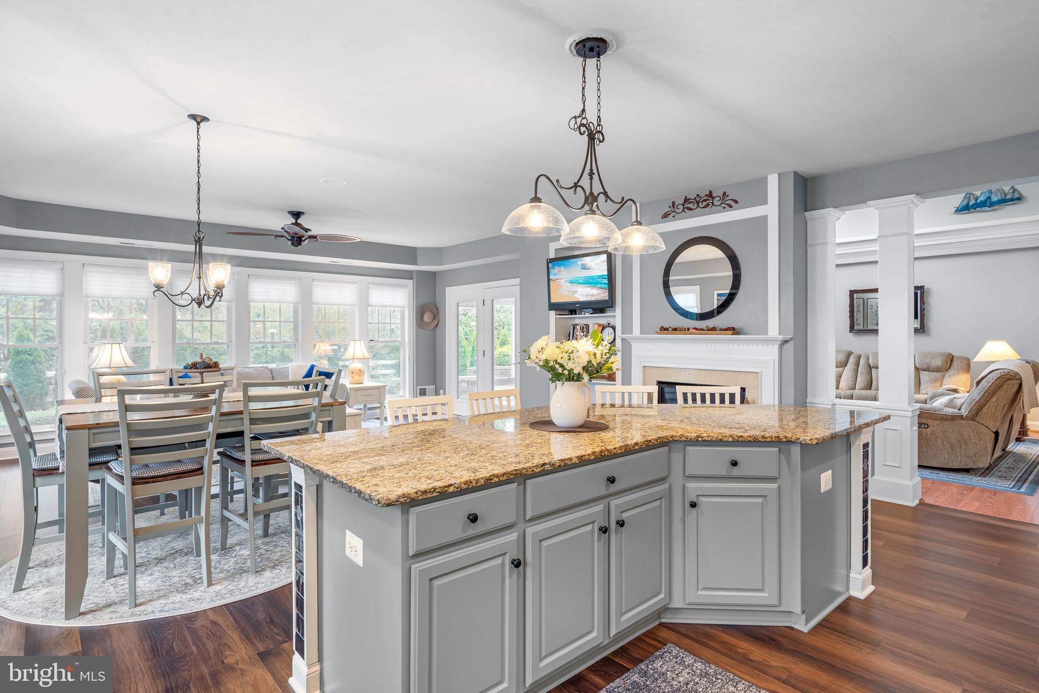 20718 Annondell Drive Lewes, DE 19958 - Photo 14 of 46 a open kitchen with a sink a stove and wooden floor