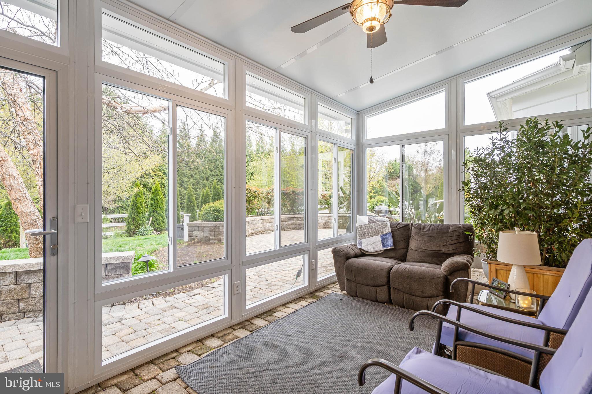 20718 Annondell Drive Lewes, DE 19958 - Photo 19 of 46 a living room with furniture and a floor to ceiling window