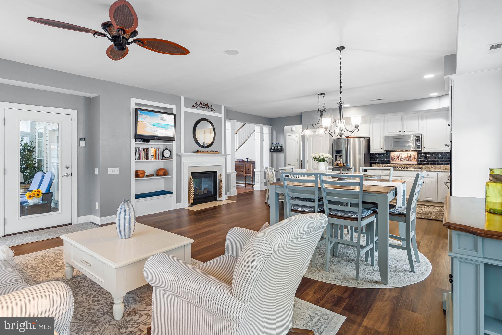 20718 Annondell Drive Lewes, DE 19958 - Photo 20 of 46 a view of a dining room and livingroom with furniture wooden floor a chandelier