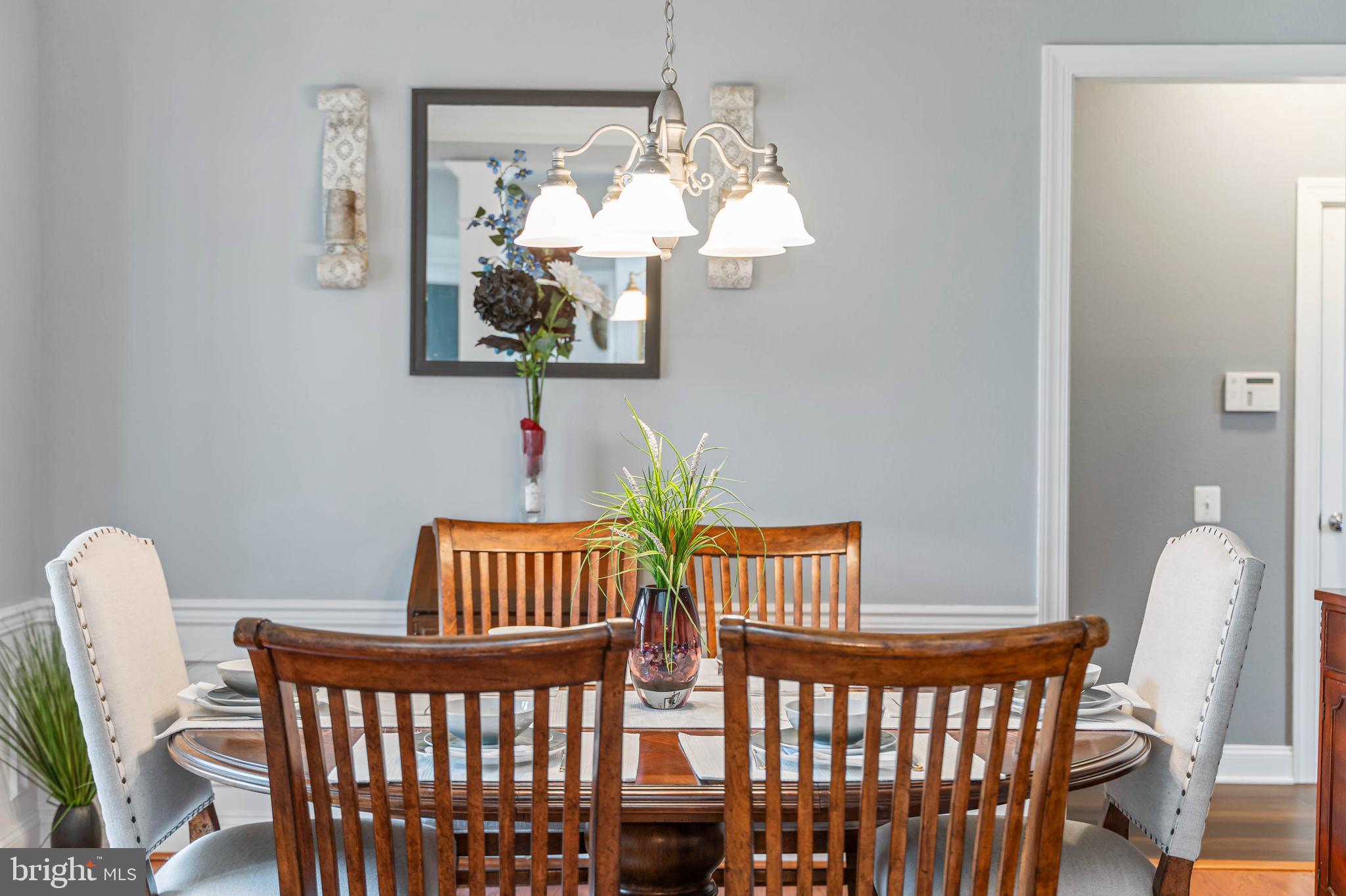 20718 Annondell Drive Lewes, DE 19958 - Photo 22 of 46 a view of a dining room with furniture and chandelier