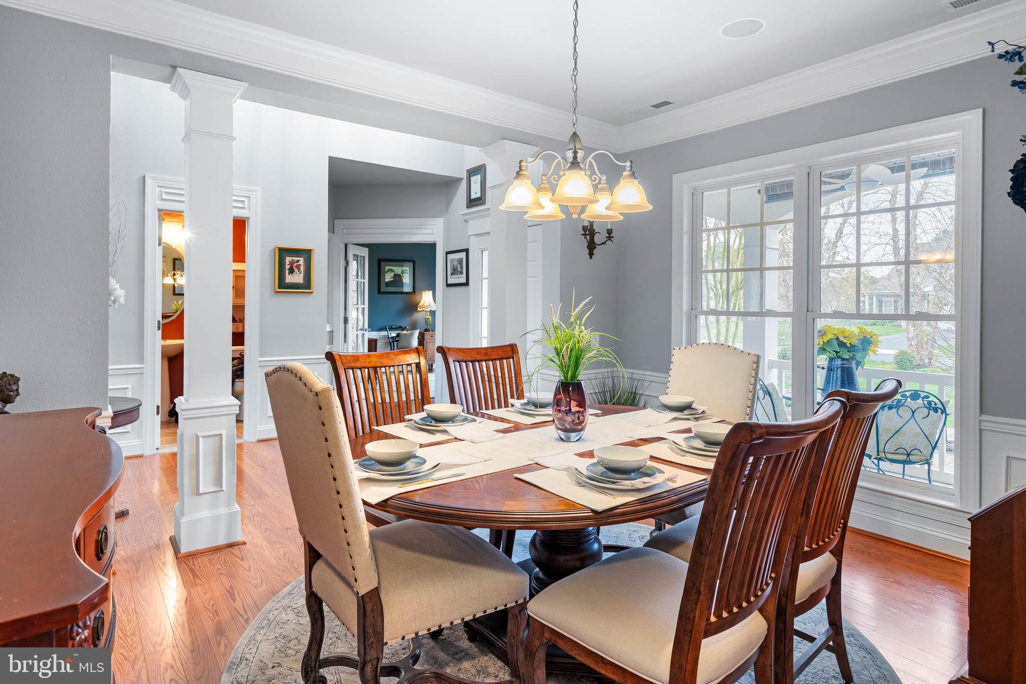 20718 Annondell Drive Lewes, DE 19958 - Photo 23 of 46 a view of a dining room with furniture a chandelier and wooden floor
