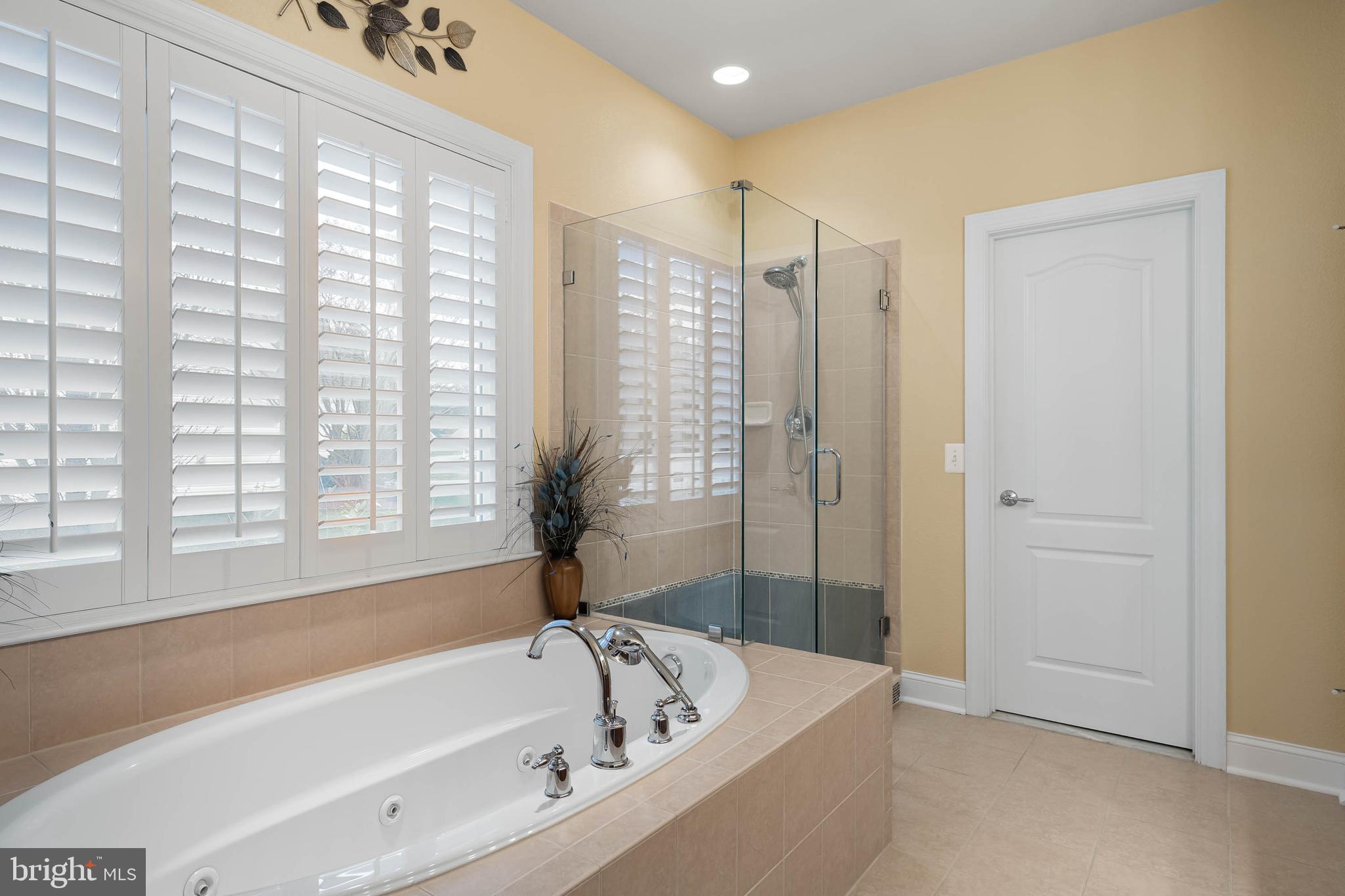 20718 Annondell Drive Lewes, DE 19958 - Photo 30 of 46 a bathroom with a bathtub and a shower
