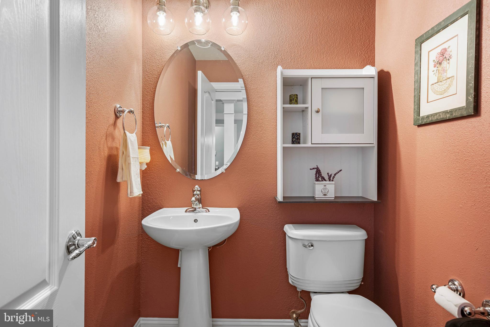 20718 Annondell Drive Lewes, DE 19958 - Photo 31 of 46 a bathroom with a toilet sink and mirror