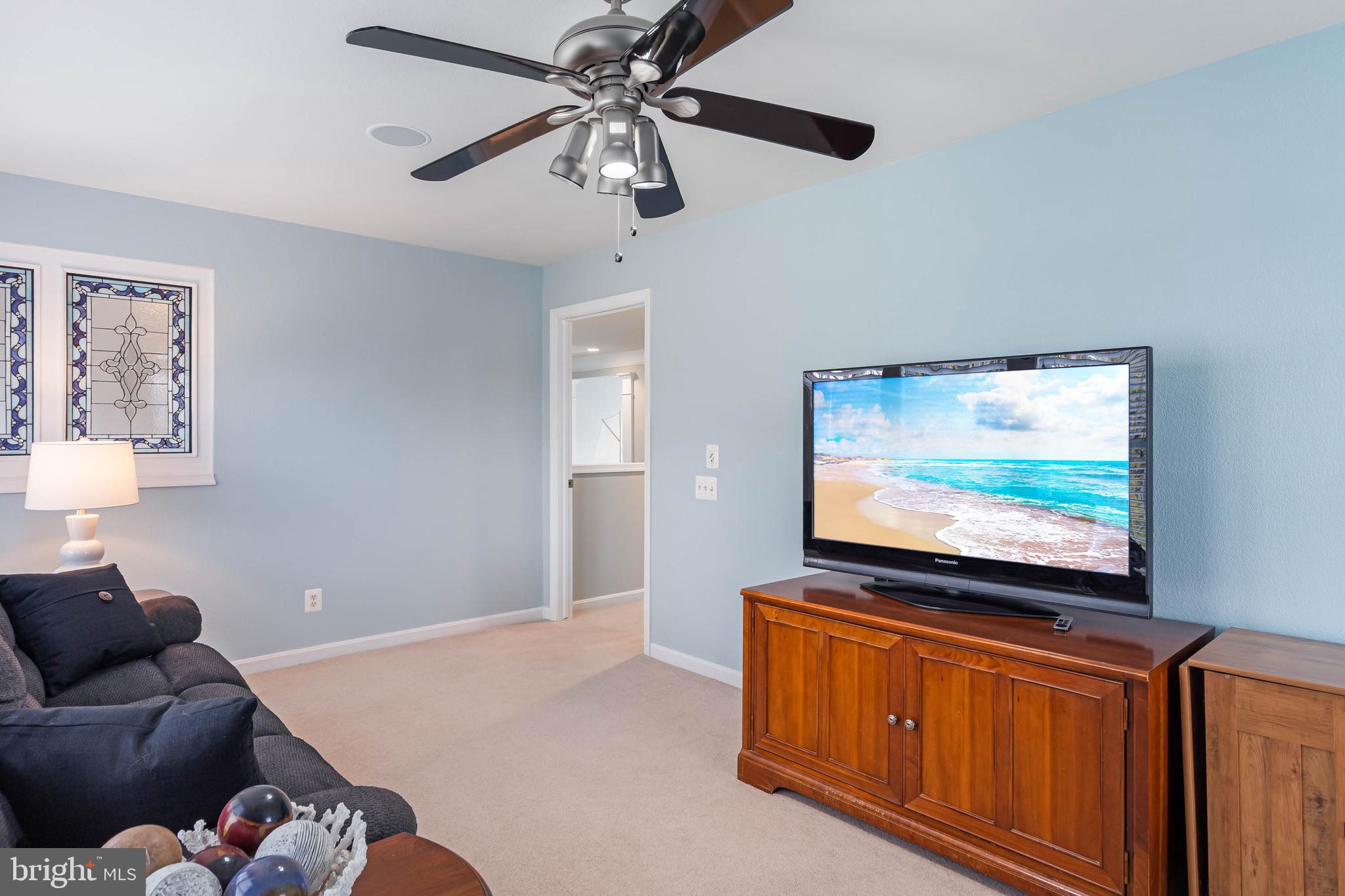 20718 Annondell Drive Lewes, DE 19958 - Photo 33 of 46 a living room with furniture and a flat screen tv