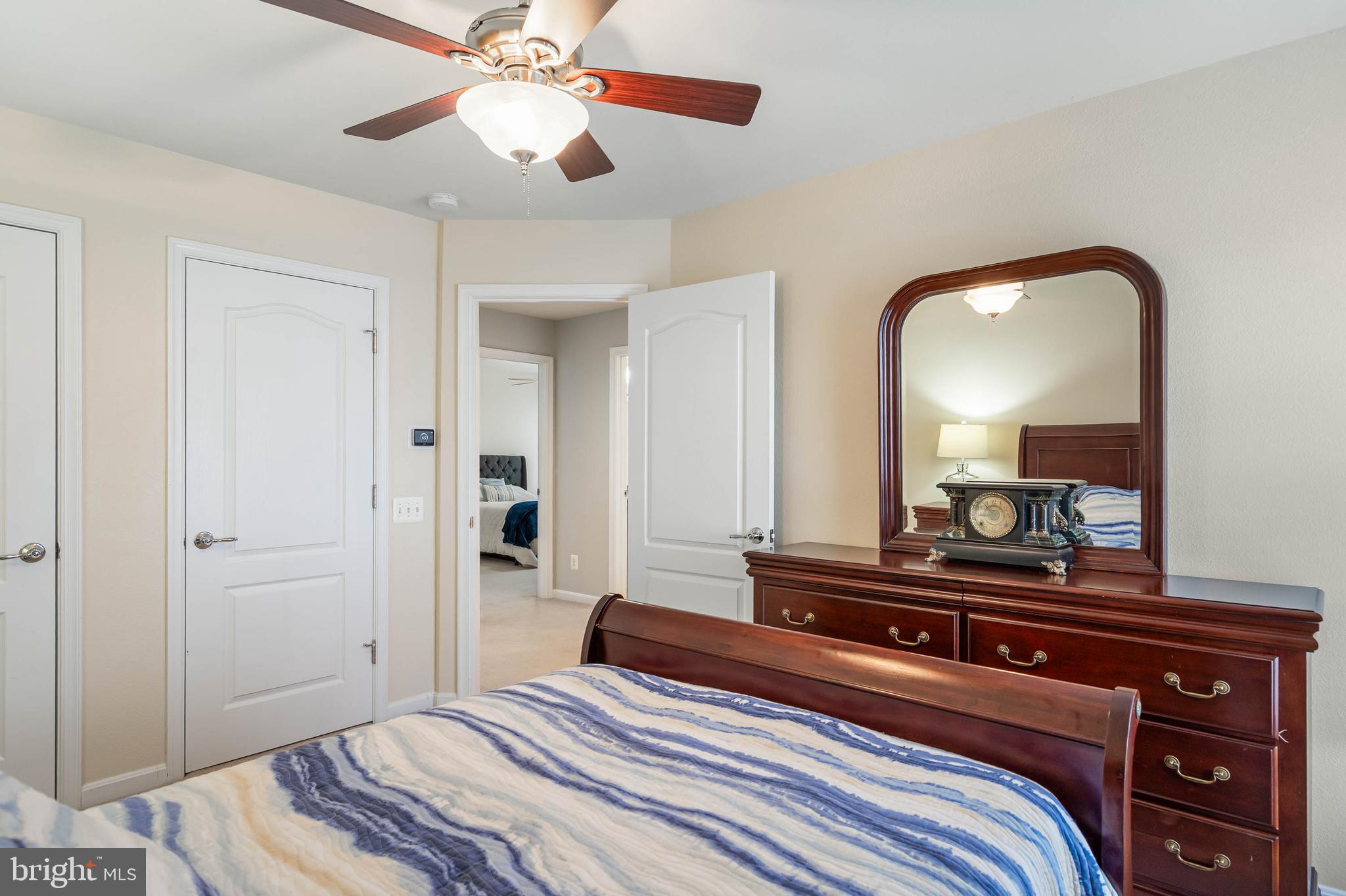 20718 Annondell Drive Lewes, DE 19958 - Photo 35 of 46 a bedroom with a bed and a large mirror on the dresser