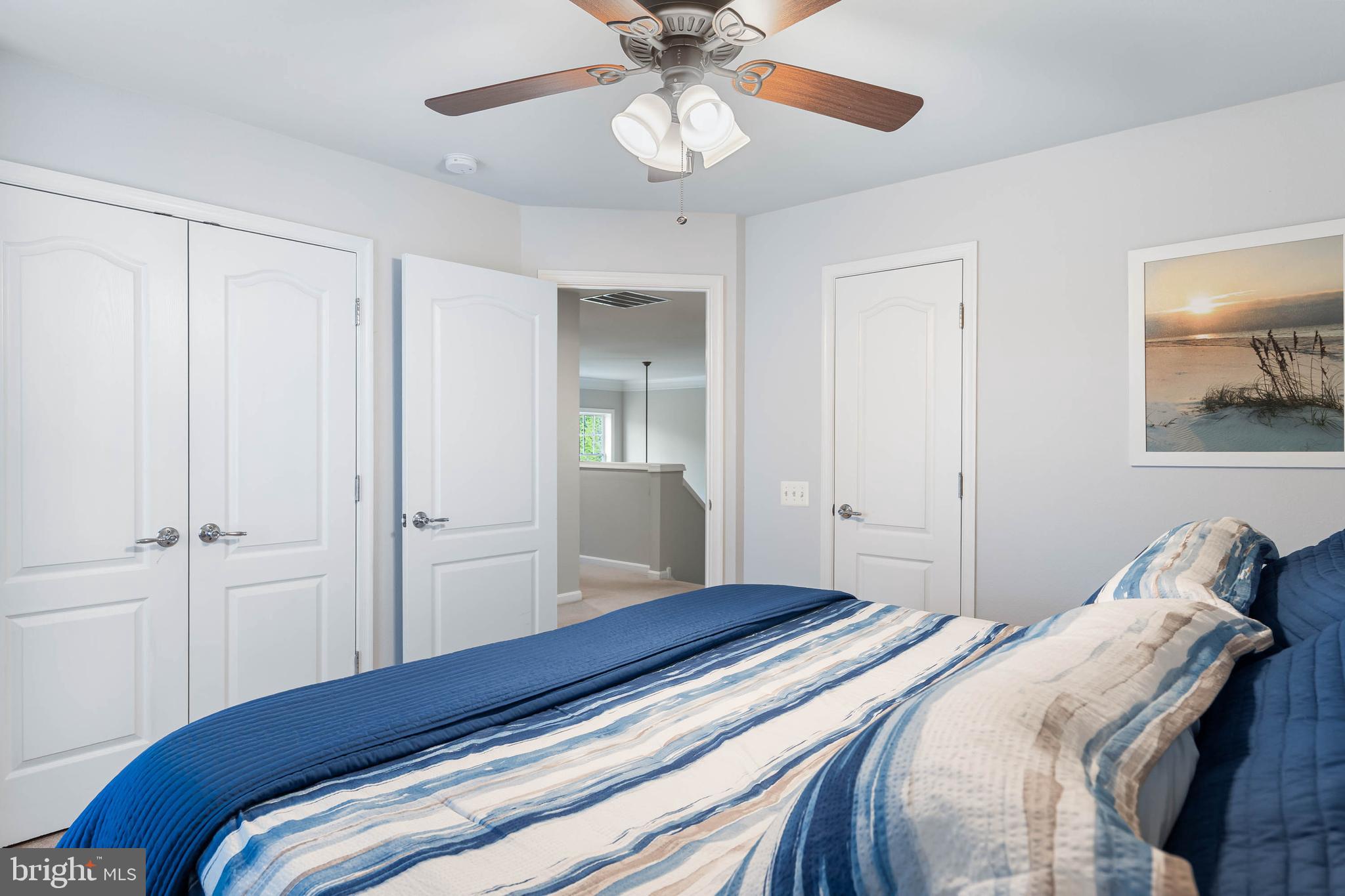 20718 Annondell Drive Lewes, DE 19958 - Photo 37 of 46 a bedroom with a bed and a chandelier