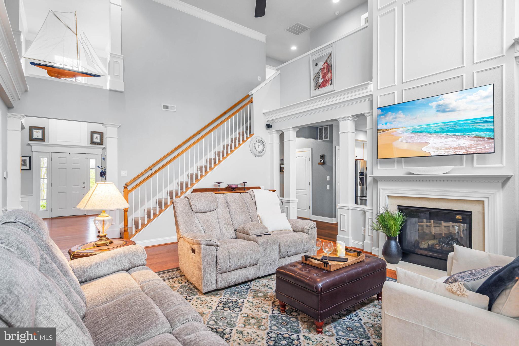 20718 Annondell Drive Lewes, DE 19958 - Photo 6 of 46 a living room with furniture fireplace and a flat screen tv