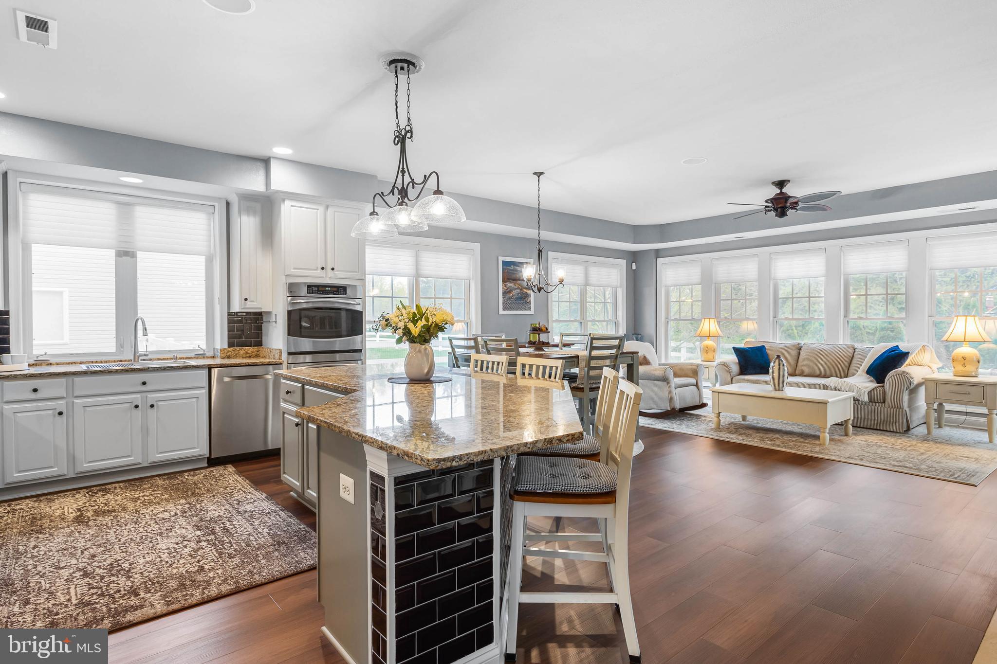20718 Annondell Drive Lewes, DE 19958 - Photo 9 of 46 a kitchen with counter top space and living room