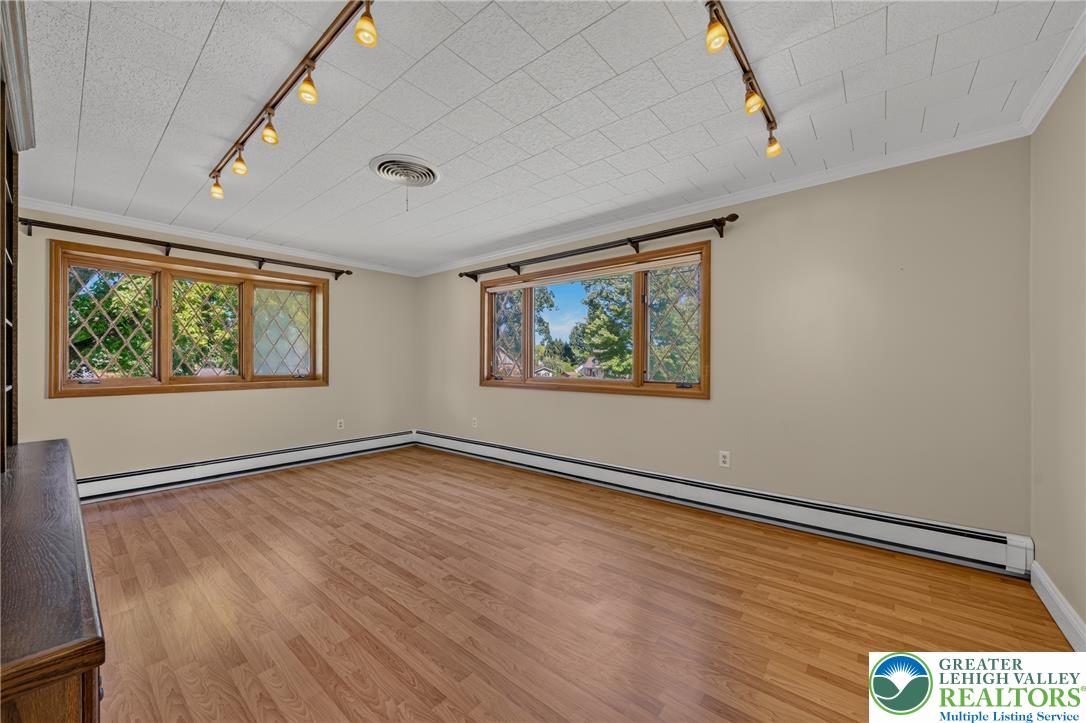1814 Ruth Street Allentown, PA 18104 - Photo 6 of 54 Gleaming hardwood floors and classic wood-framed windows elevate this versatile living space.