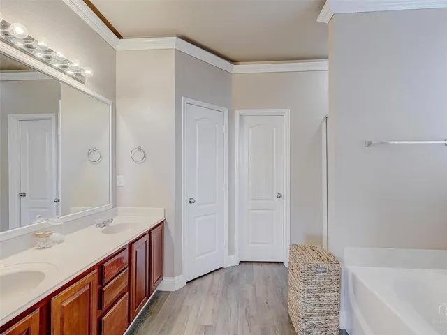 a bathroom with a bathtub and a window