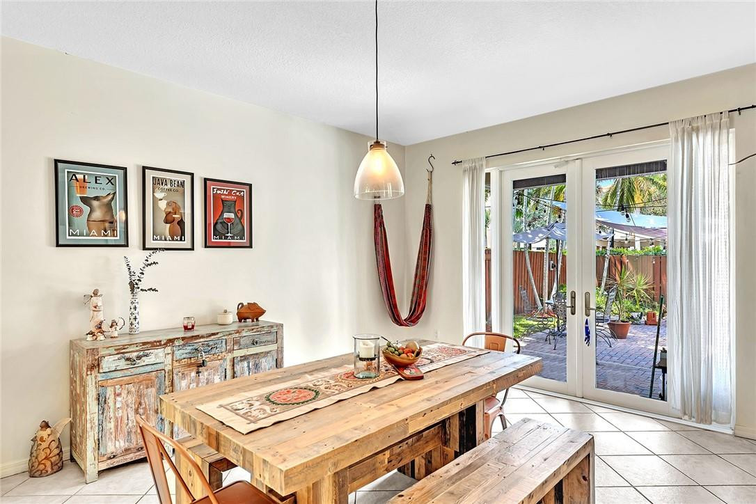 15971 Southwest 96th Terrace Miami, FL 33196 - Photo 12 of 79 a view of a dining room with furniture window and wooden floor