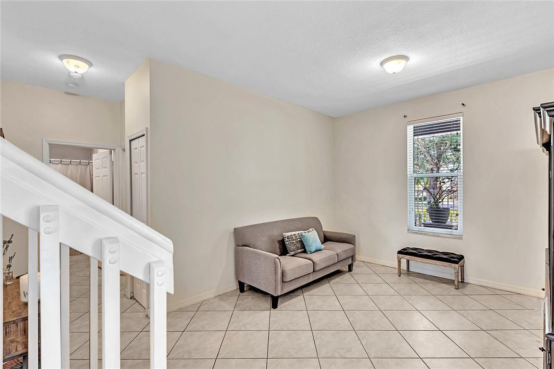 15971 Southwest 96th Terrace Miami, FL 33196 - Photo 15 of 79 a living room with furniture and a couch