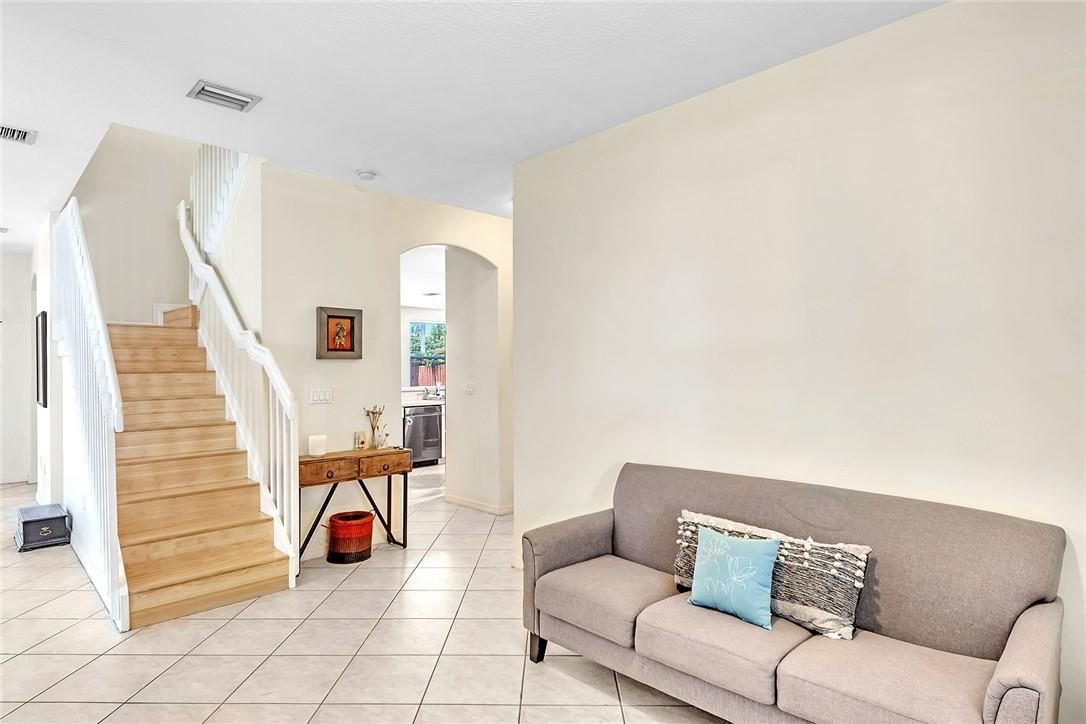 15971 Southwest 96th Terrace Miami, FL 33196 - Photo 18 of 79 a living room with furniture and wooden floor