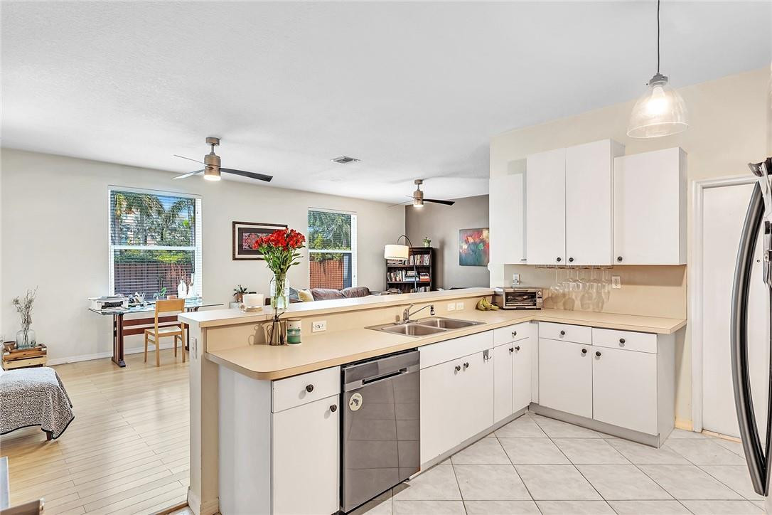 15971 Southwest 96th Terrace Miami, FL 33196 - Photo 19 of 79 a kitchen with a sink window and cabinets