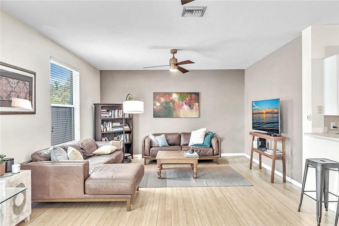 15971 Southwest 96th Terrace Miami, FL 33196 - Photo 28 of 79 a living room with furniture and a flat screen tv