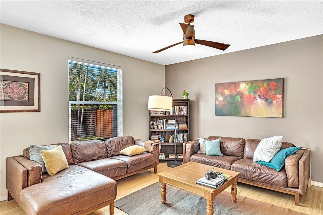 15971 Southwest 96th Terrace Miami, FL 33196 - Photo 33 of 79 a living room with furniture and a window