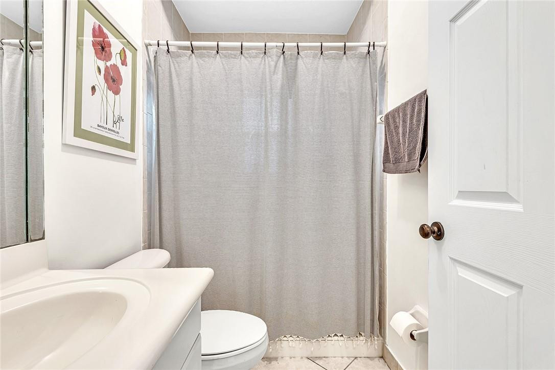 15971 Southwest 96th Terrace Miami, FL 33196 - Photo 37 of 79 a white toilet sitting next to a bathroom sink