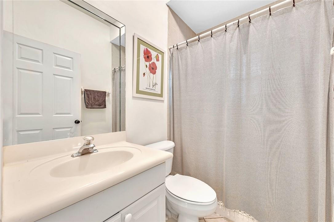 15971 Southwest 96th Terrace Miami, FL 33196 - Photo 38 of 79 a bathroom with a sink and a mirror