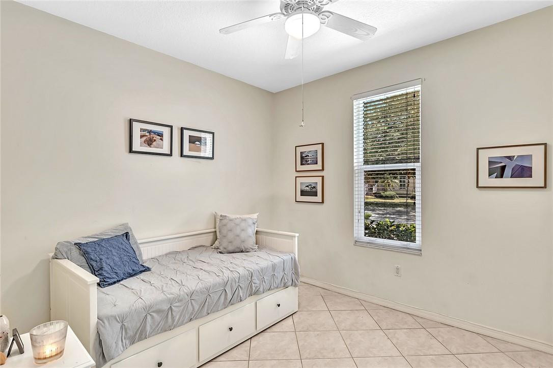 15971 Southwest 96th Terrace Miami, FL 33196 - Photo 39 of 79 a bedroom with a bed and a window