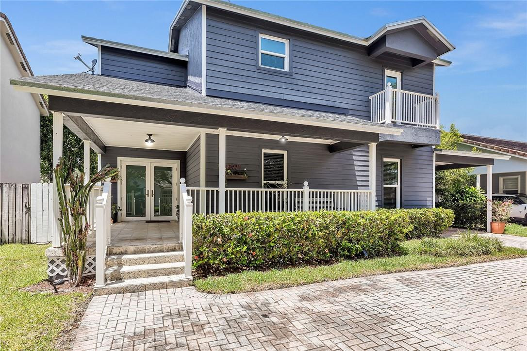 15971 Southwest 96th Terrace Miami, FL 33196 - Photo 6 of 79 a view of a house with a garden