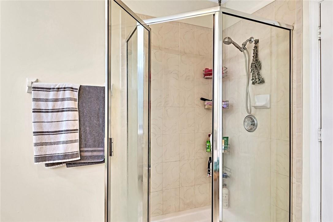 15971 Southwest 96th Terrace Miami, FL 33196 - Photo 62 of 79 a bathroom with a shower and a glass door