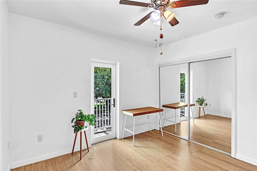 15971 Southwest 96th Terrace Miami, FL 33196 - Photo 64 of 79 a living room with furniture and a potted plant