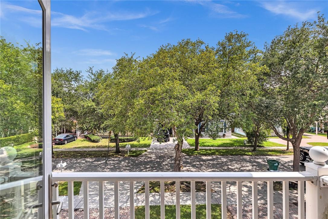 15971 Southwest 96th Terrace Miami, FL 33196 - Photo 66 of 79 a view of a yard in front of a house with a large tree