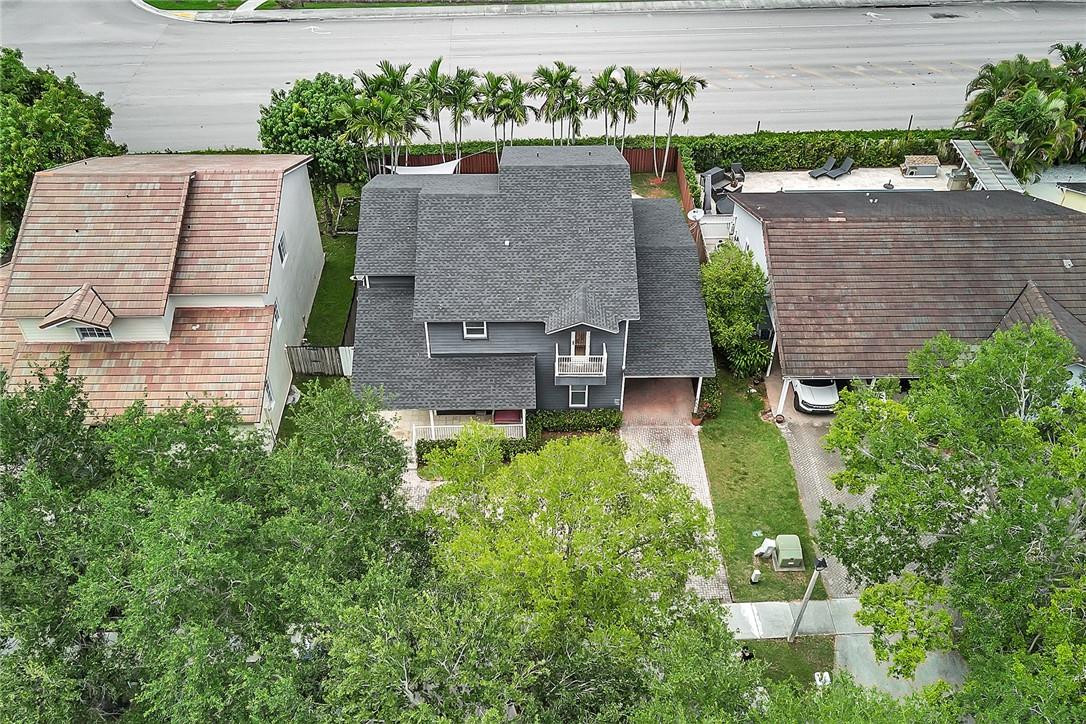 15971 Southwest 96th Terrace Miami, FL 33196 - Photo 76 of 79 an aerial view of a house with a yard