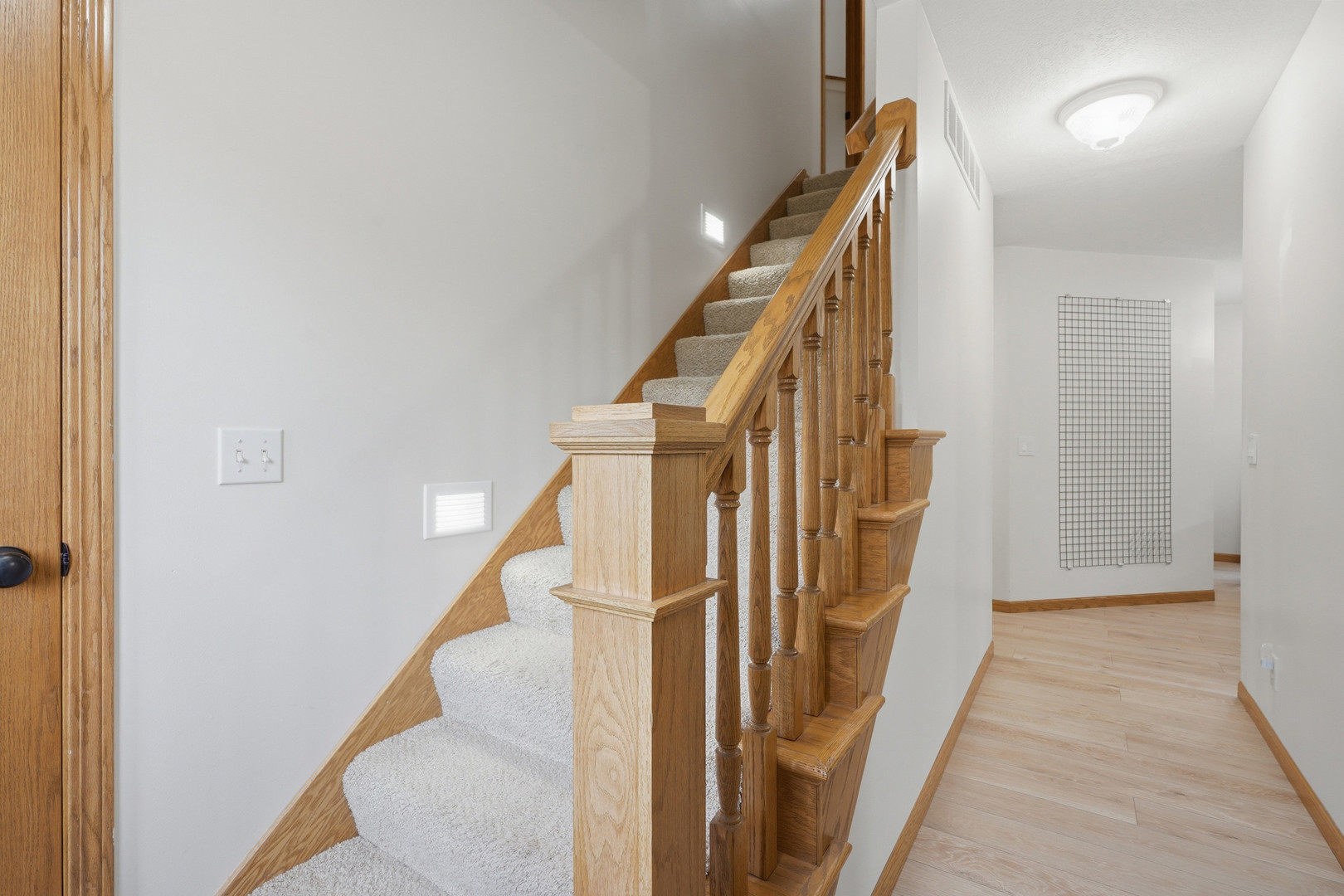 2237 Hickory Hills Road Muscatine, IA 52761 - Photo 3 of 53 a view of a hallway with staircase