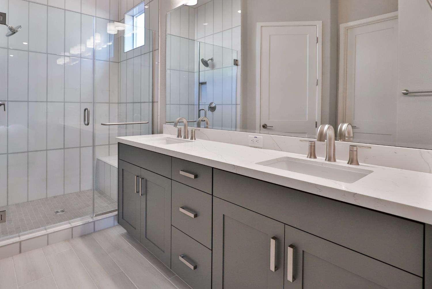 4610 Clb Vista Way Penryn, CA 95663 - Photo 13 of 27 a bathroom with double sink and a mirror