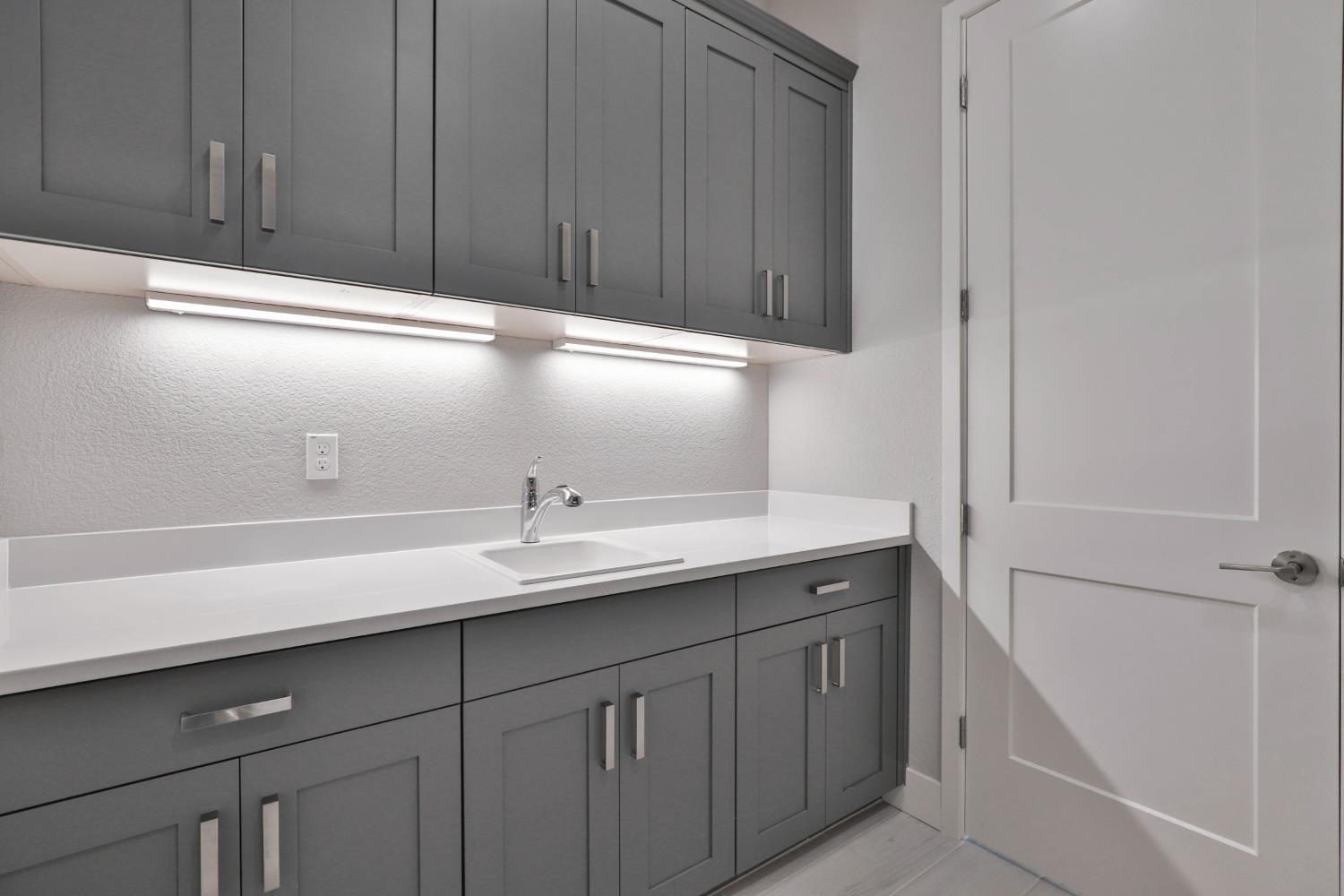 4610 Clb Vista Way Penryn, CA 95663 - Photo 20 of 27 a kitchen with a sink and cabinets