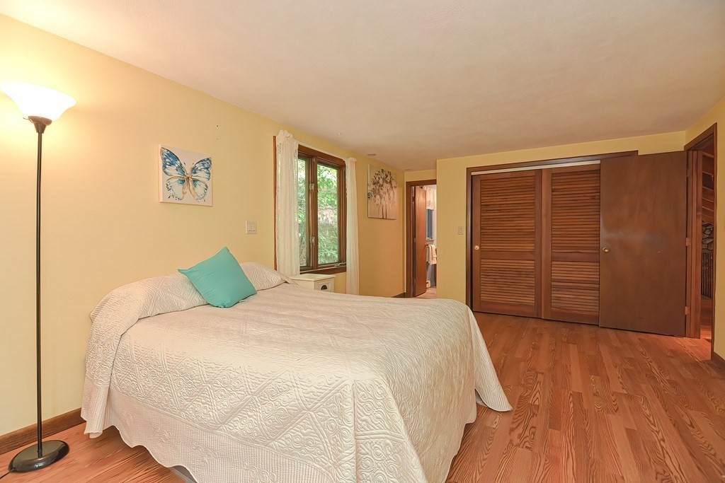 202 Boxboro Road Stow, MA 01775 - Photo 20 of 40 a bedroom with a bed and a closet
