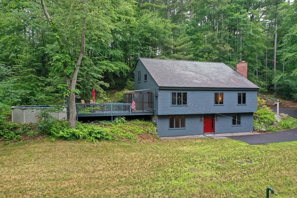 202 Boxboro Road Stow, MA 01775 - Photo 2 of 40 a view of a house with a yard plants and large tree