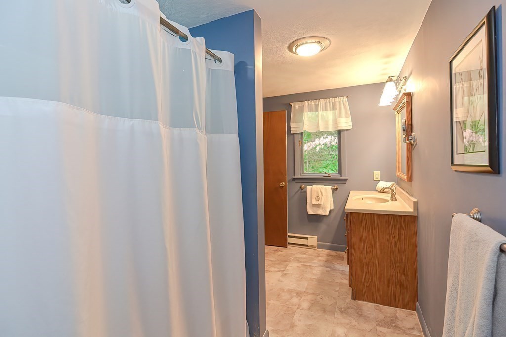 202 Boxboro Road Stow, MA 01775 - Photo 25 of 40 a view of bathroom with a tub shower